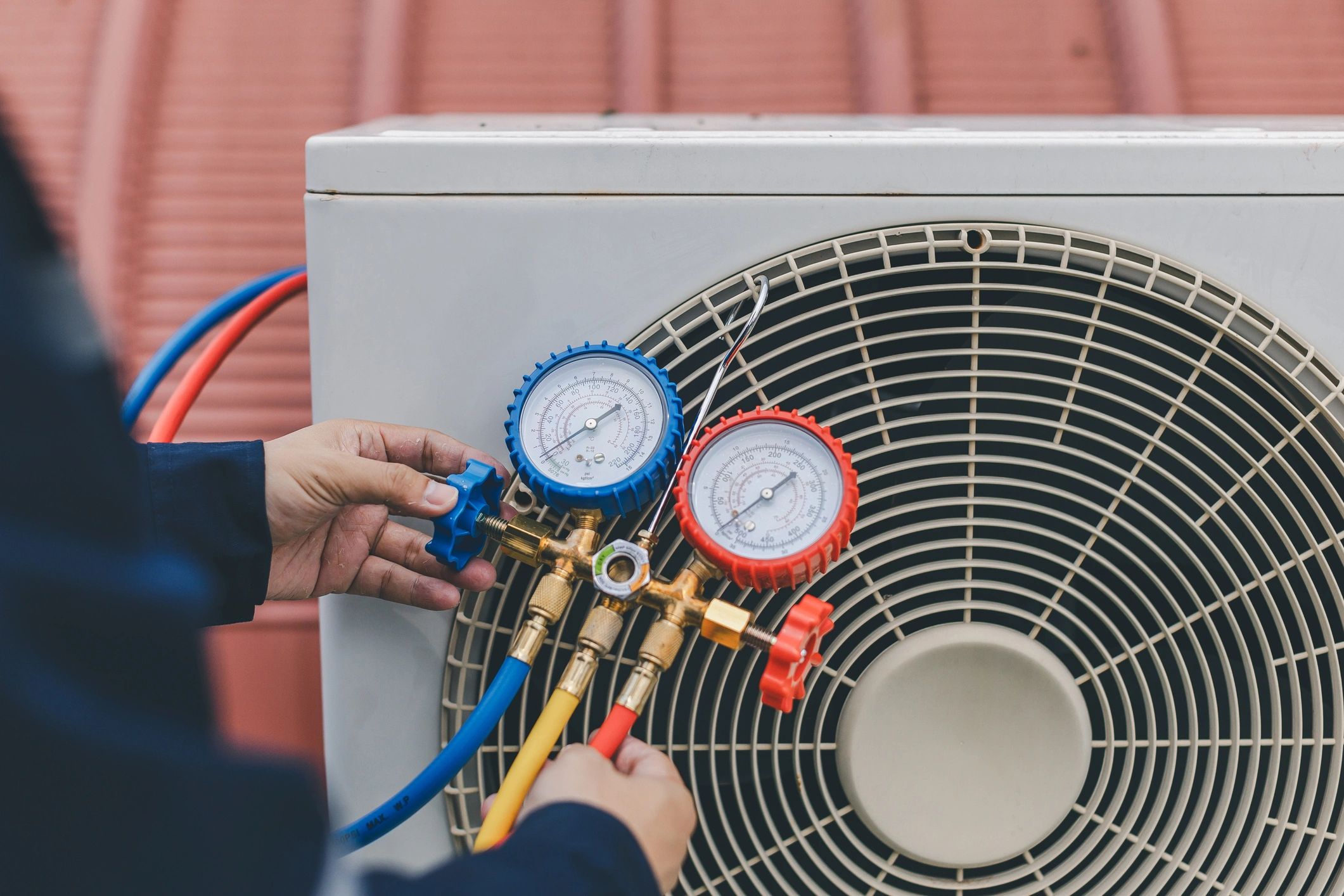 Technician checking air conditioner